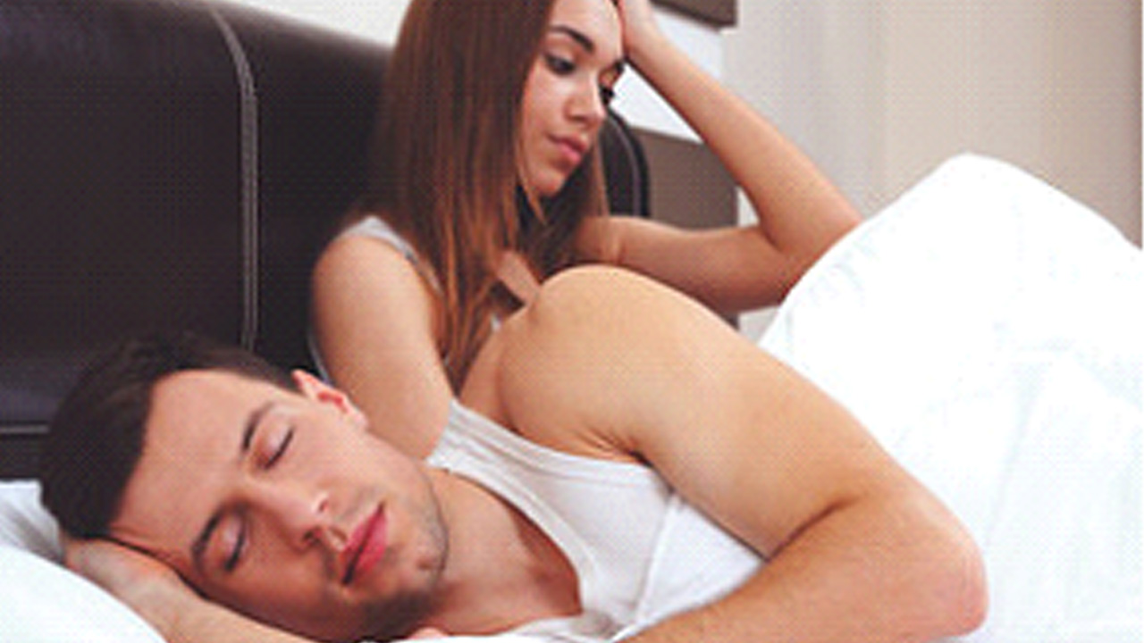 Tense partners suffering from sleep apnea. 