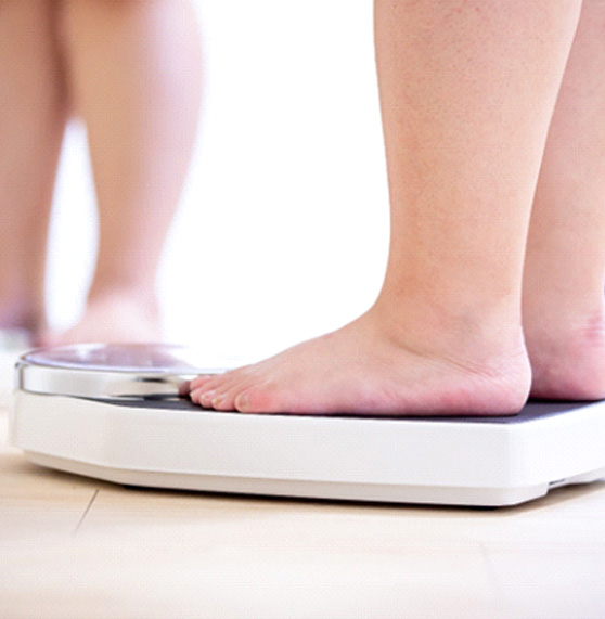 A person standing on a scale