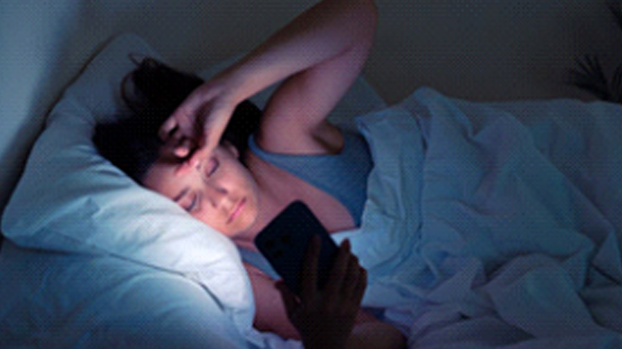 person on their sleep while in bed at night